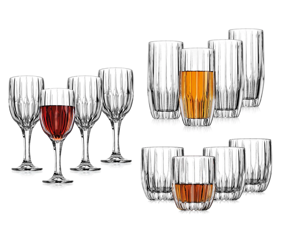 Set of twelve clear unlead crystal glasses including four goblets, four highballs, and four double old fashion tumblers.
