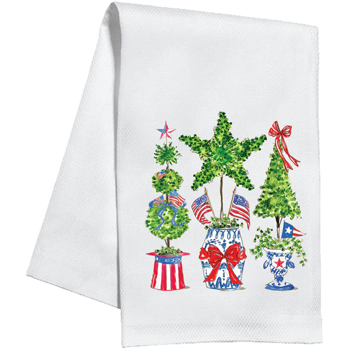 White cotton kitchen towel featuring three patriotic topiaries in red, white, and blue pots.