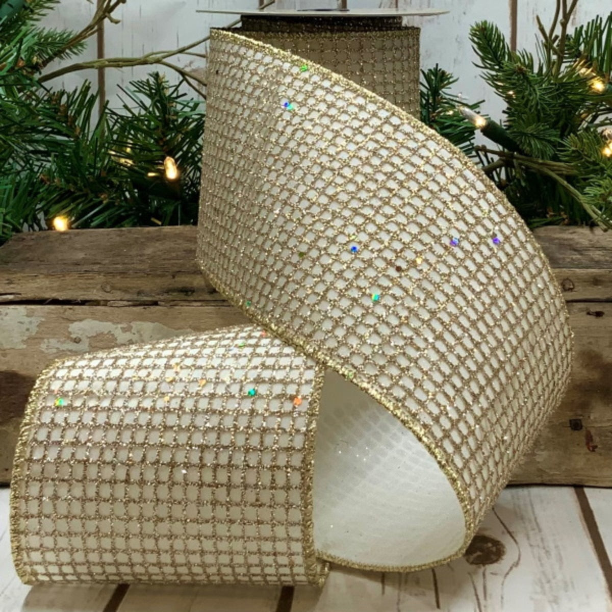 4-inch wide taffeta glitter mesh ribbon in silver with a shimmering texture.