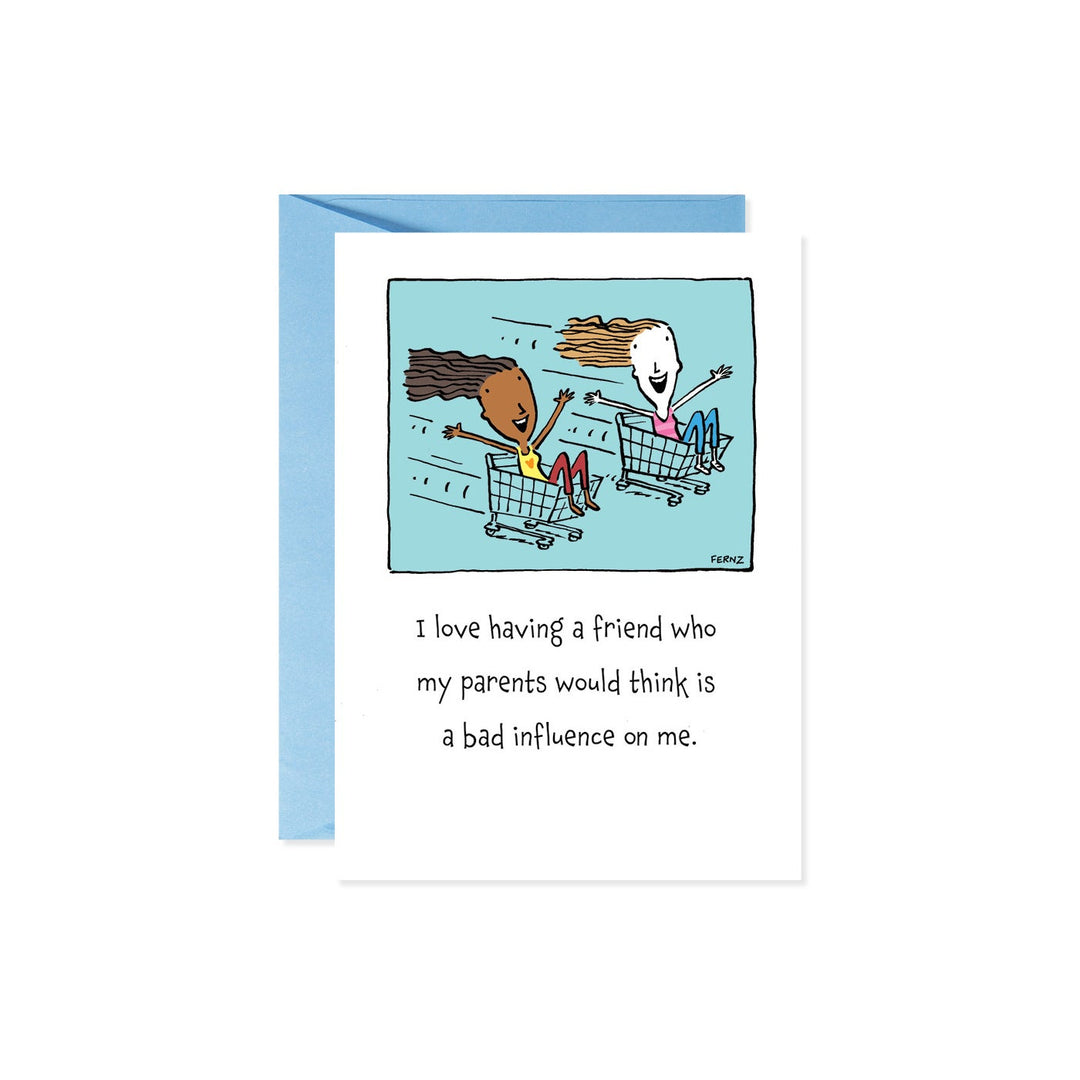Card with cartoon of two friends in shopping carts, text reads 'I love having a friend who my parents would think is a bad influence on me.'