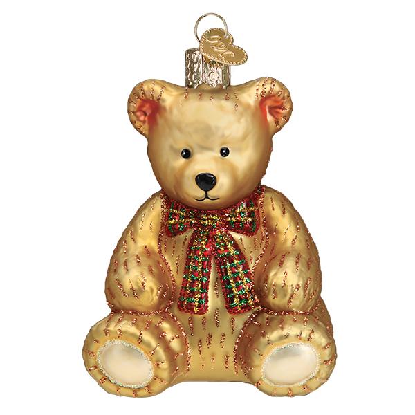 Gold glass teddy bear ornament with a red and green plaid bow and glitter accents.