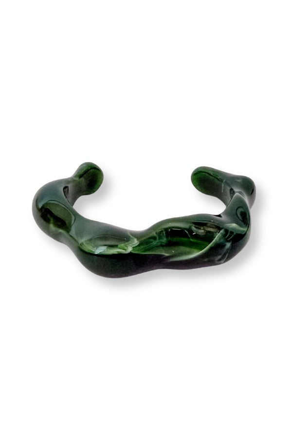 WS Isla Bangle in dark green resin with a chunky, sculptural wavy design and open-bottom cuff.