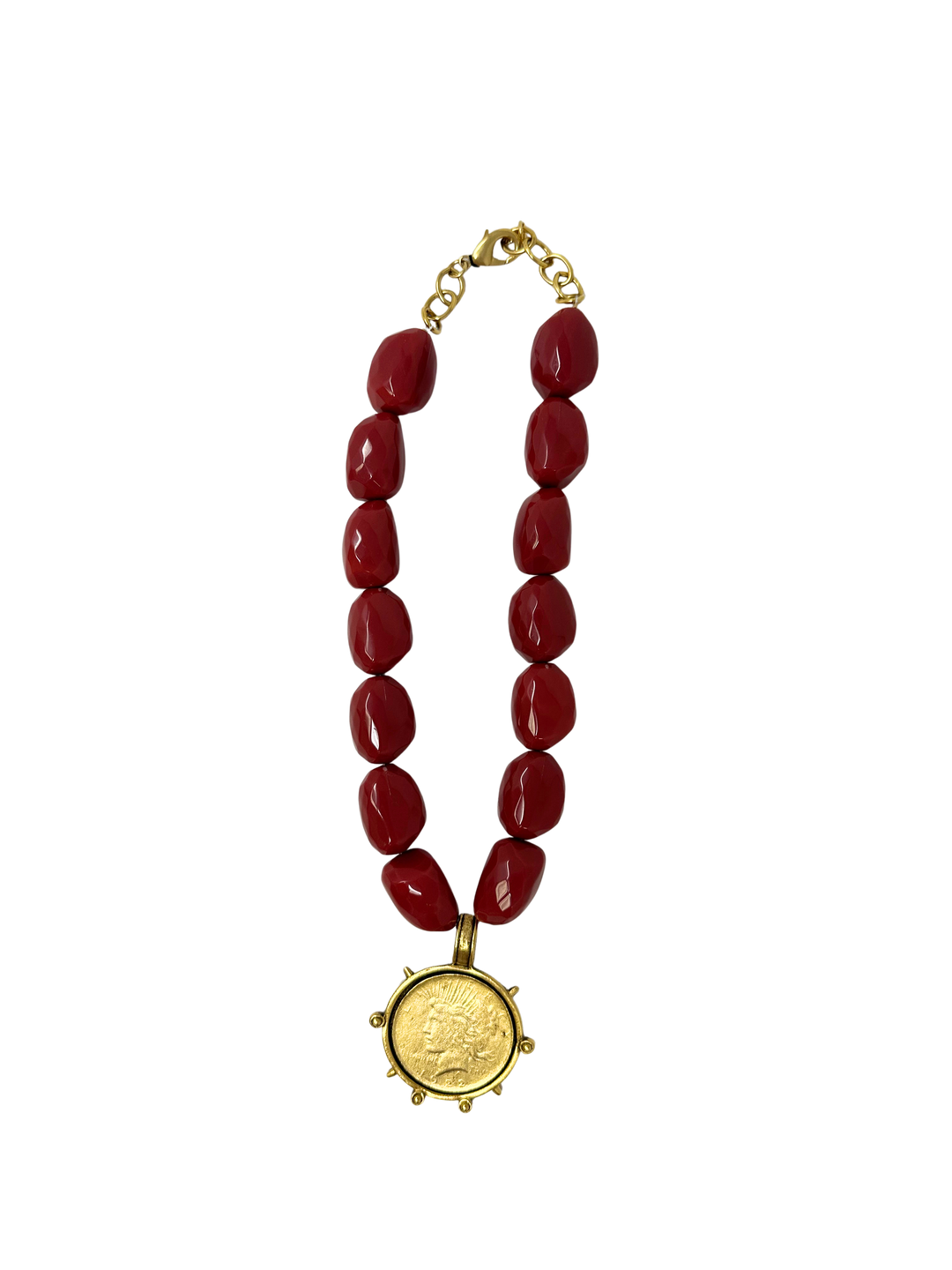 Red bead necklace with a gold Liberty coin pendant and lobster clasp.
