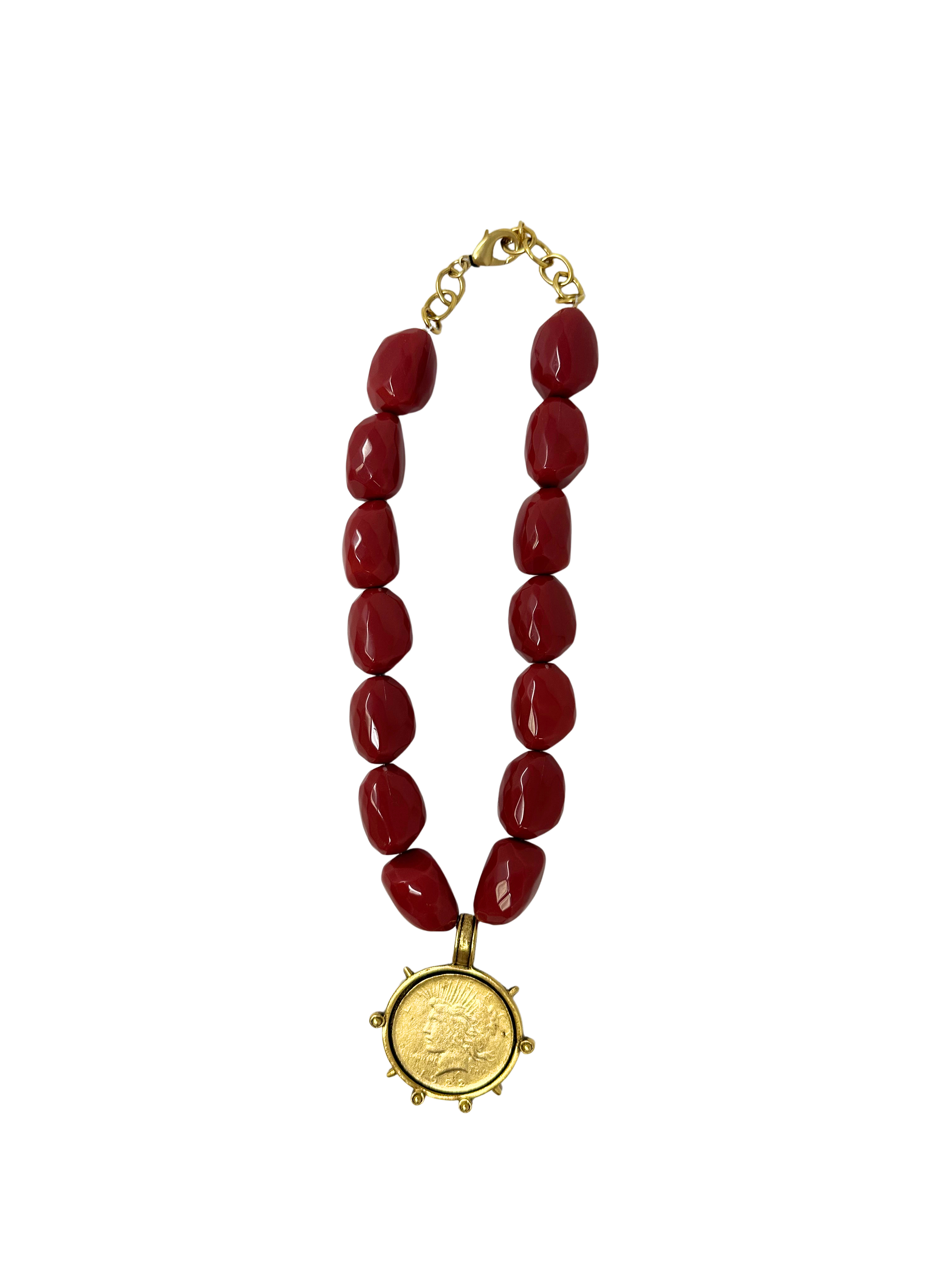 Red bead necklace with a gold Liberty coin pendant and lobster clasp.