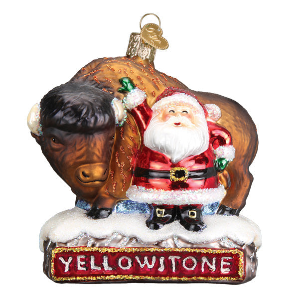 Glass Christmas ornament featuring Santa Claus standing next to a bison on a Yellowstone base.