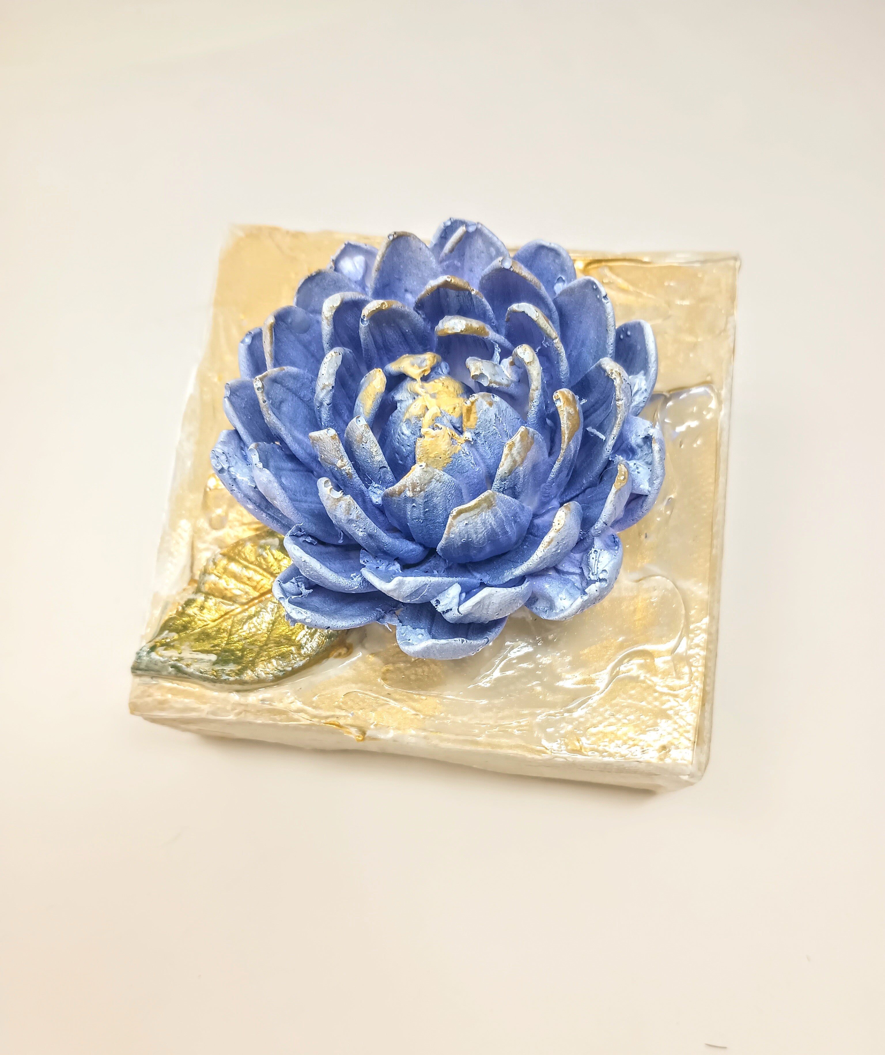 4x4 inch square clay artwork featuring a mum flower with textured petals in earthy tones.