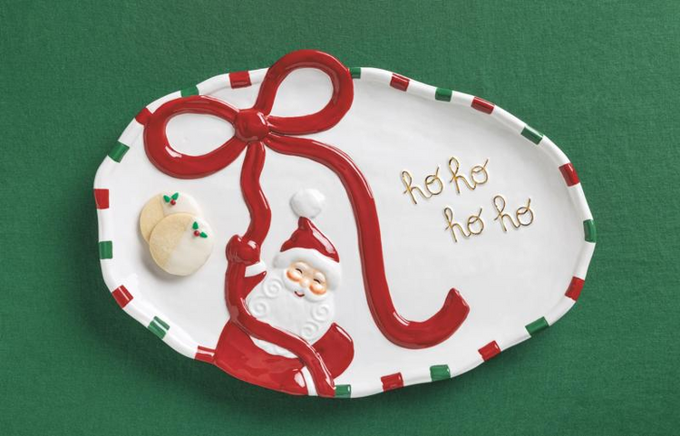 Oval ceramic Santa platter with a raised red bow, gold 'ho ho ho' text, and two cookies.