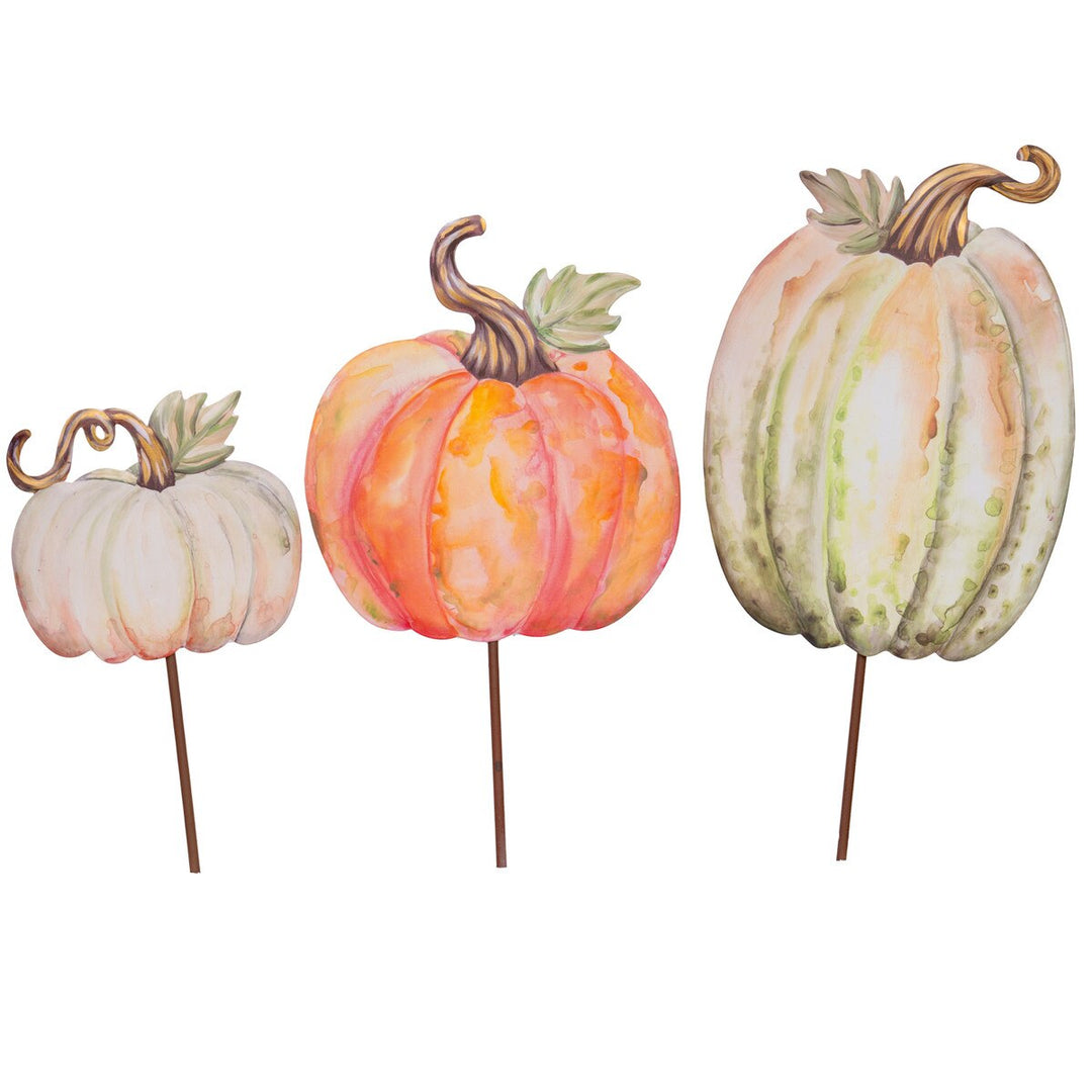 Set of three watercolor-style pumpkin garden stakes in white, orange, and green.