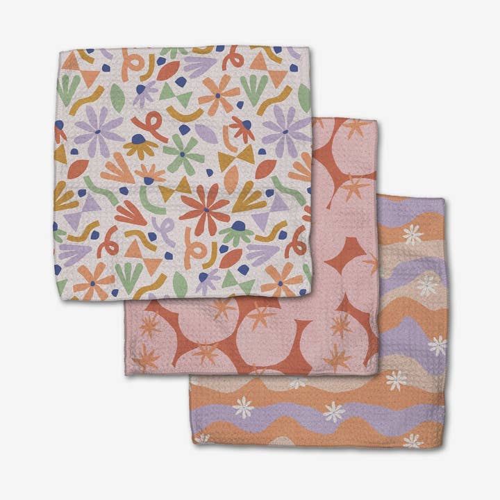Set of three waffle weave dishcloths in recycled polyester with single-sided prints and hang loops.