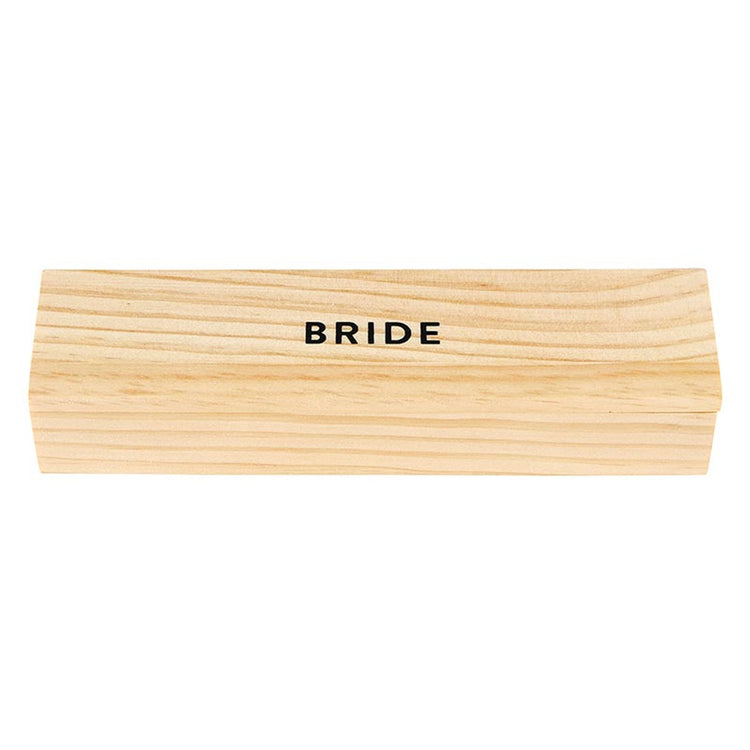 Rectangular light-colored pinewood box with the word BRIDE printed in black on the lid.