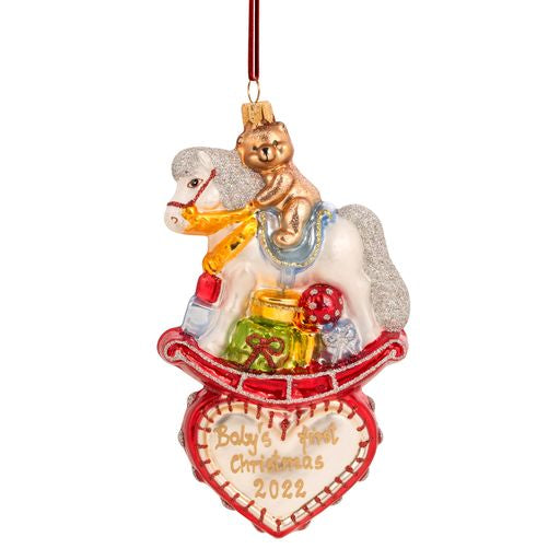 Rocking horse ornament with a teddy bear and gifts on a heart saying Baby's First Christmas 2022.