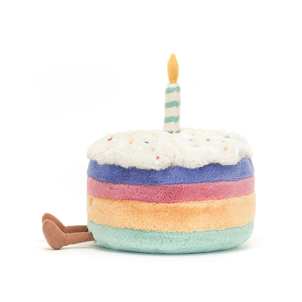 Amuseables Rainbow Birthday Cake plush toy with polyester fibers filling in rainbow pattern.