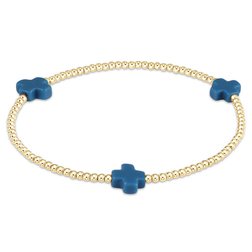 Signature Cross gold-filled bracelet with a cross bead pattern on elastic cord