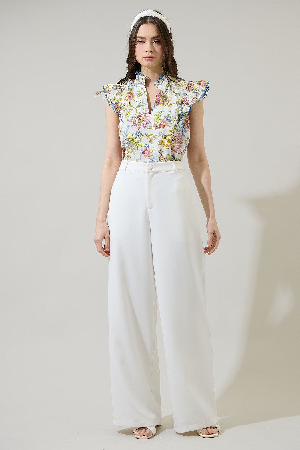 Elsa Pany floral ruffle top in white cotton with a relaxed silhouette.