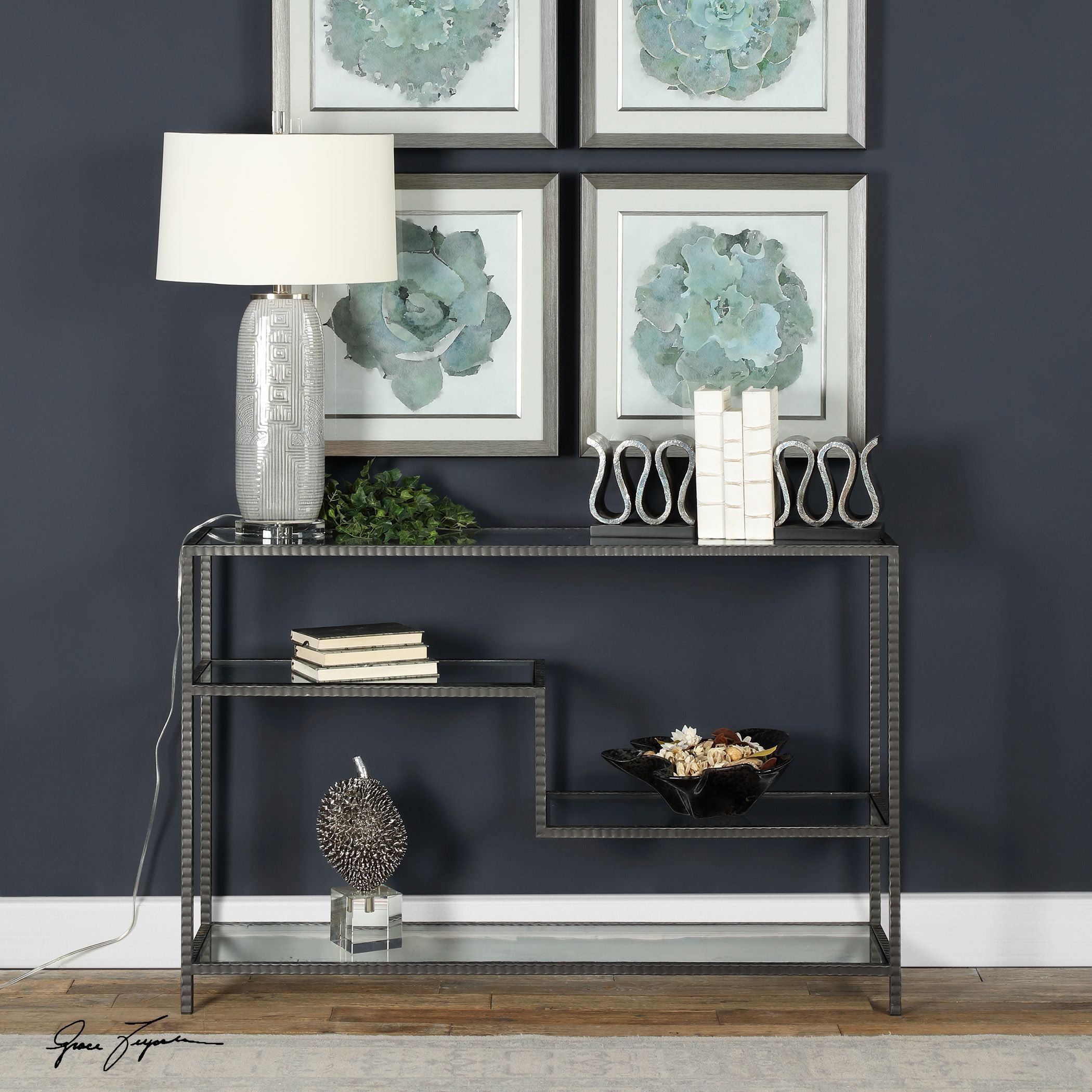Leo Industrial console table featuring a dark wood top with visible grain on slender metal legs.