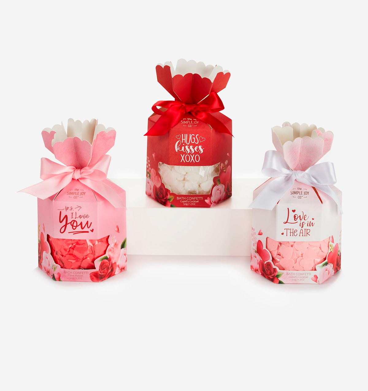 Scented Bath Confetti in a clear jar with colorful confetti pieces floating inside.