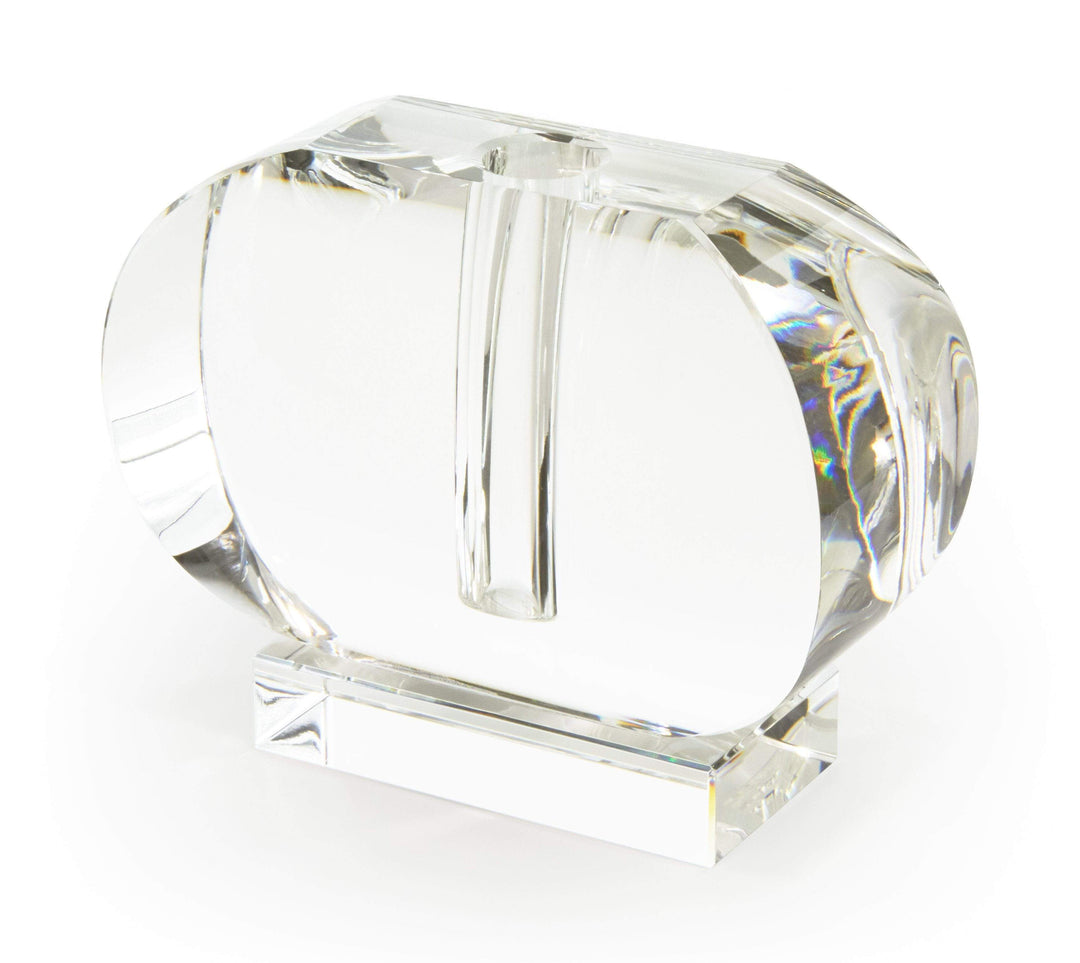 Crystal horizontal oval bud vase with a minimalist clear glass design holding one stem.