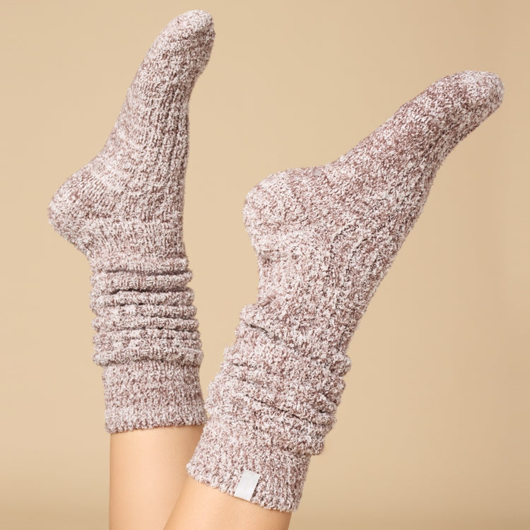 Slouchy marshmallow socks in heathered gray with non-slip grippers on the sole.