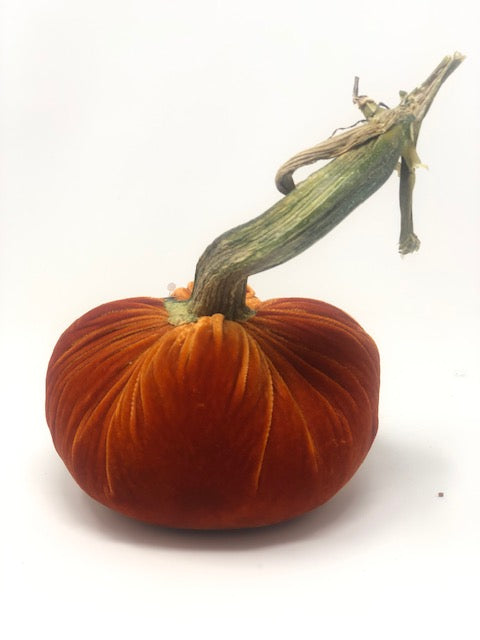 Handmade velvet pumpkin in deep orange with a natural stem.