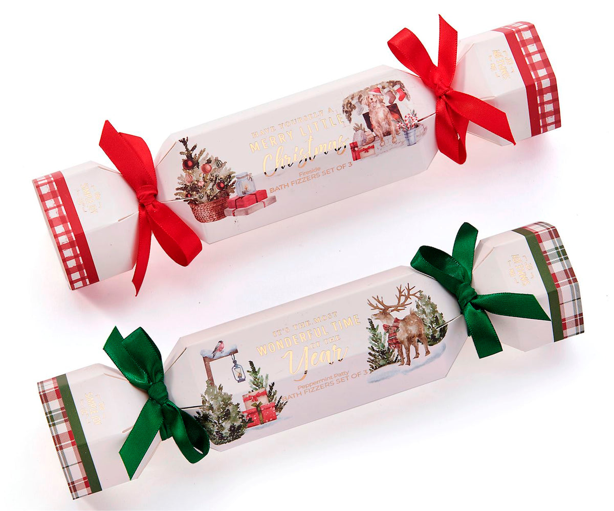 Round Christmas scented bath fizzer with festive red and green colors.