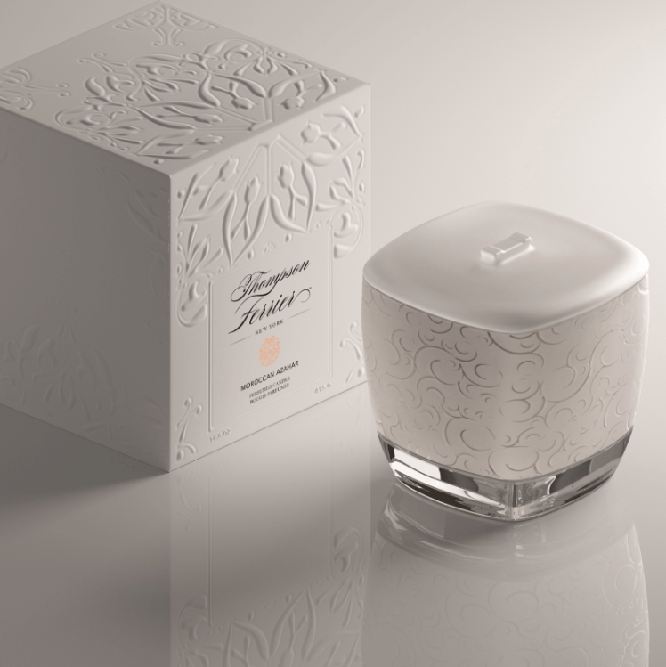 Moroccan Azahar candle in a clear glass jar with white wax.