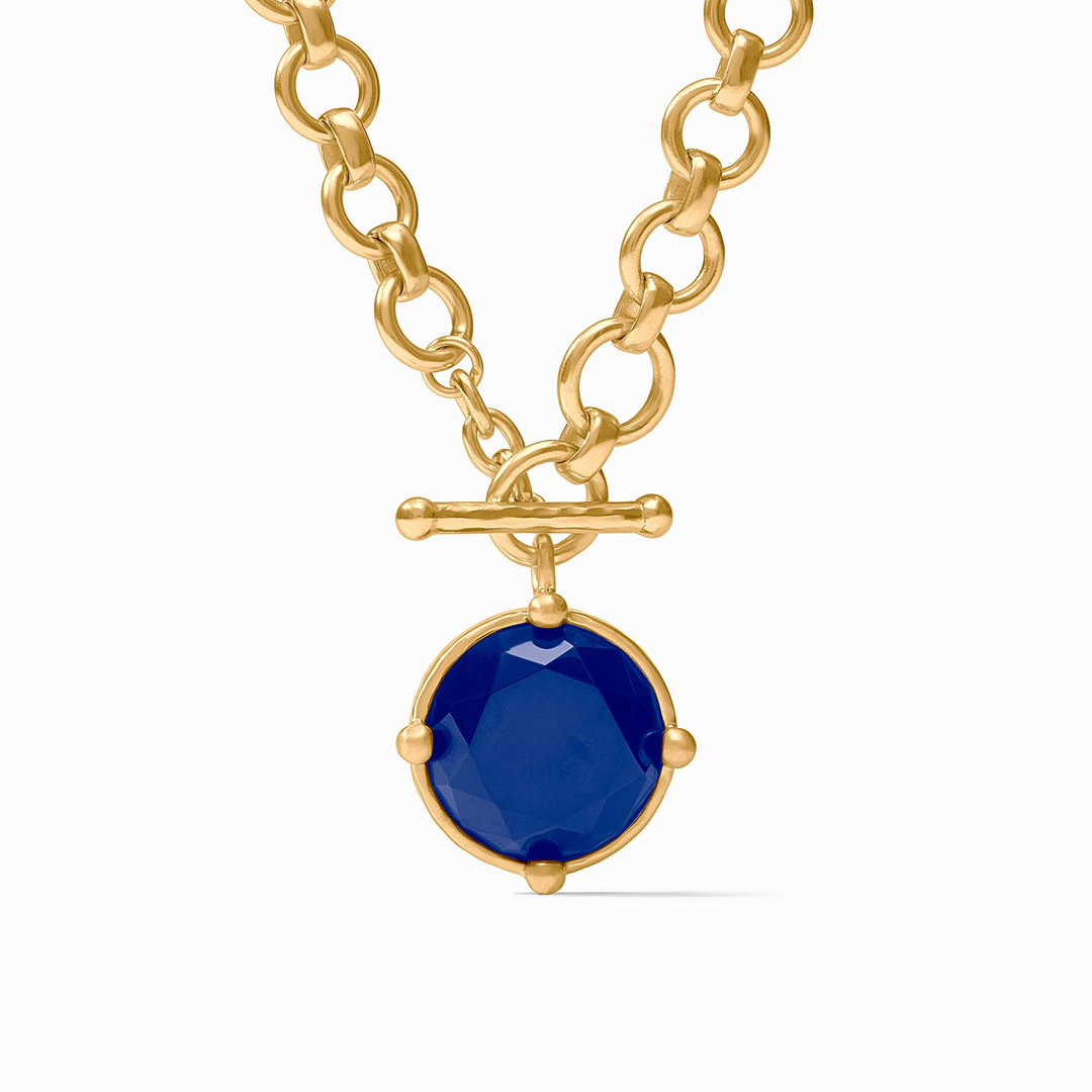 Honeybee Demi Necklace featuring a gold chain and a round blue rose-cut stone pendant.
