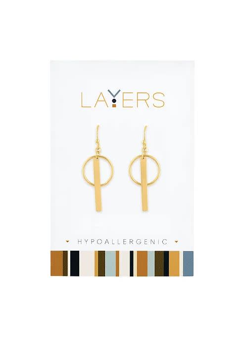 Gold Circle & Bar Dangle Layers Earrings on a white display card with a colorful striped border.
