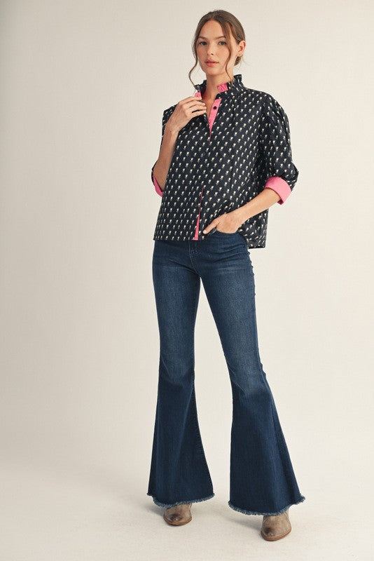 Women's floral button-down top with ruffled neckline, solid contrast trim, three-quarter sleeves in cotton.