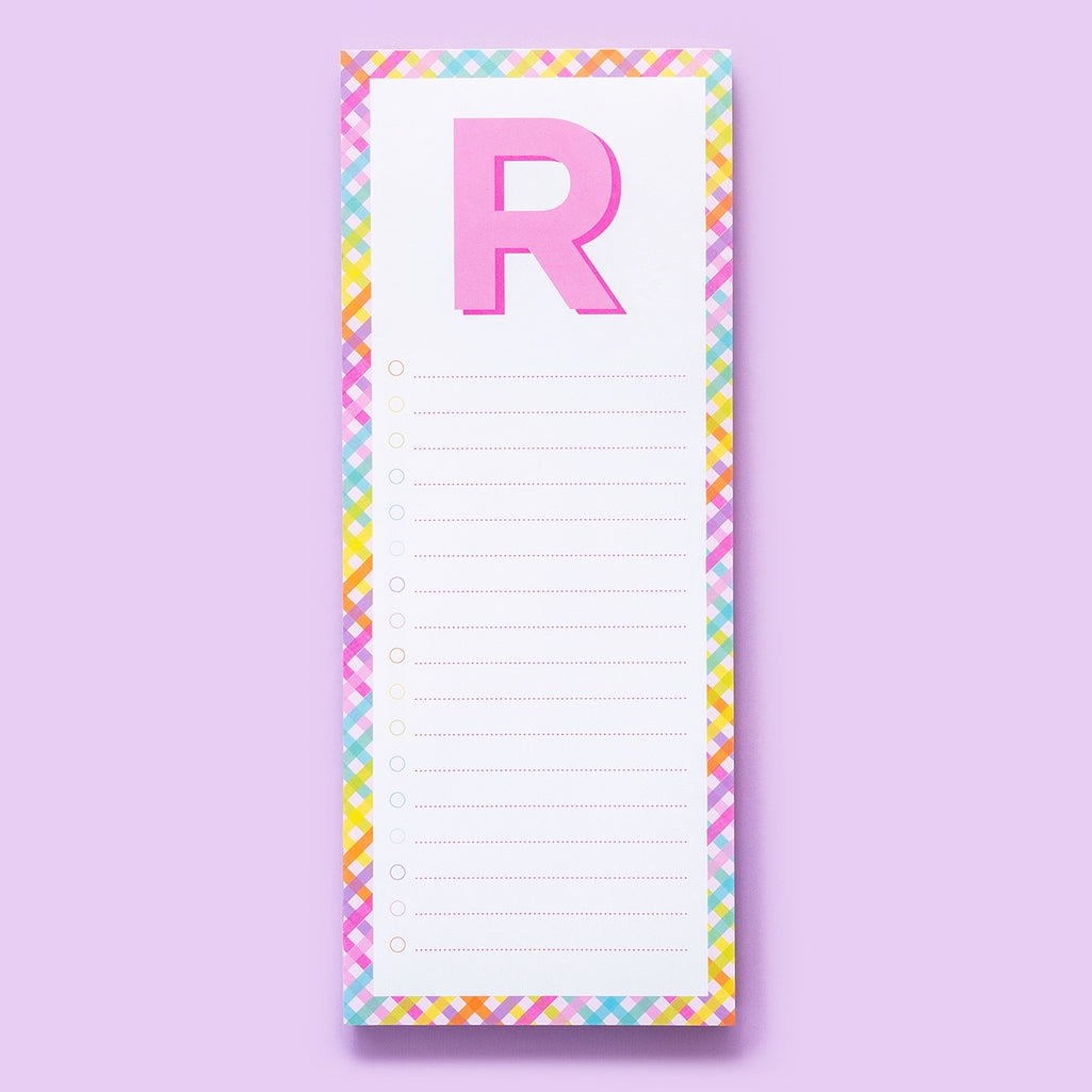 A list pad featuring lined white paper sheets with a magnet on the back.