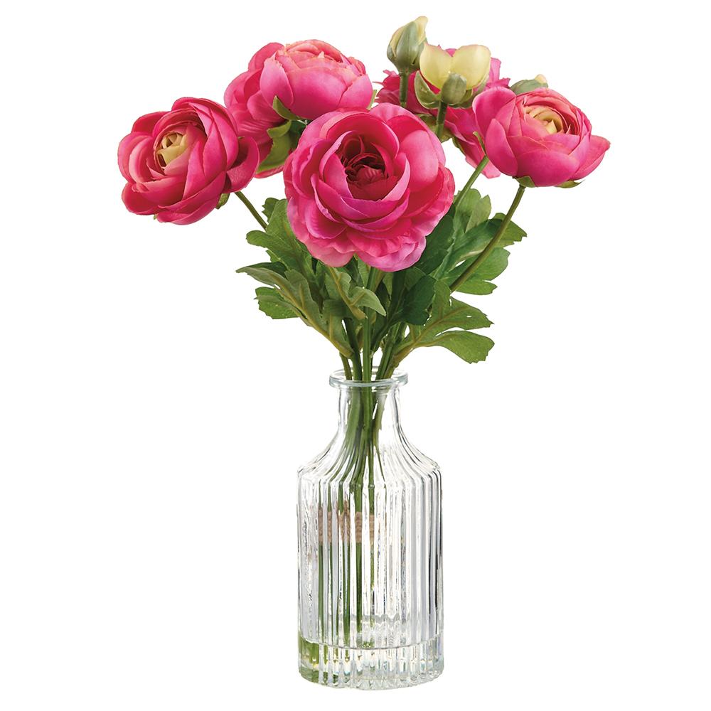 Glass vase holding an artificial pink ranunculus flower with a wire stem structure.