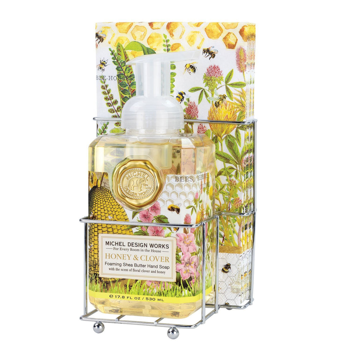 Foaming soap dispenser with matching napkin holder in a compact countertop set.