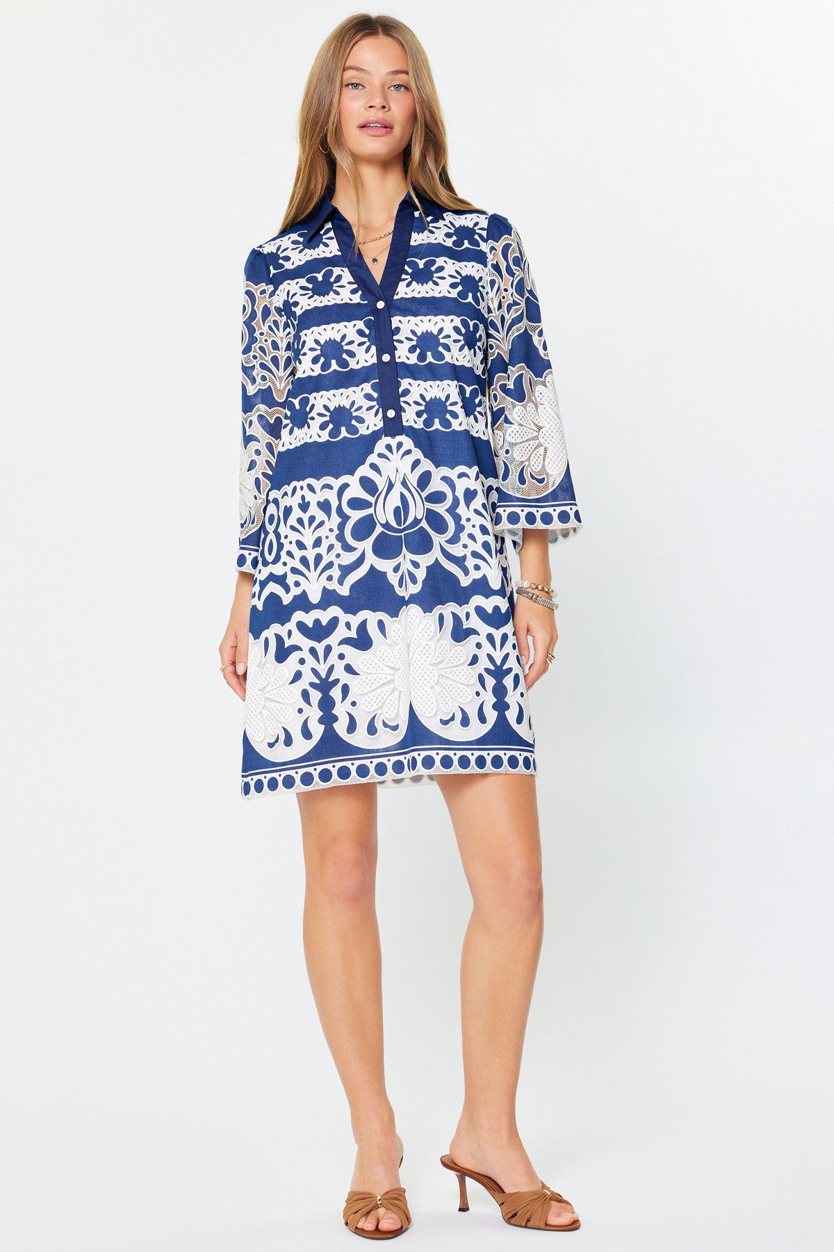 Avery mini dress in rayon/poly blend featuring a collared neckline, button placket, contrast embroidered lace floral pattern, and relaxed tunic silhouette.