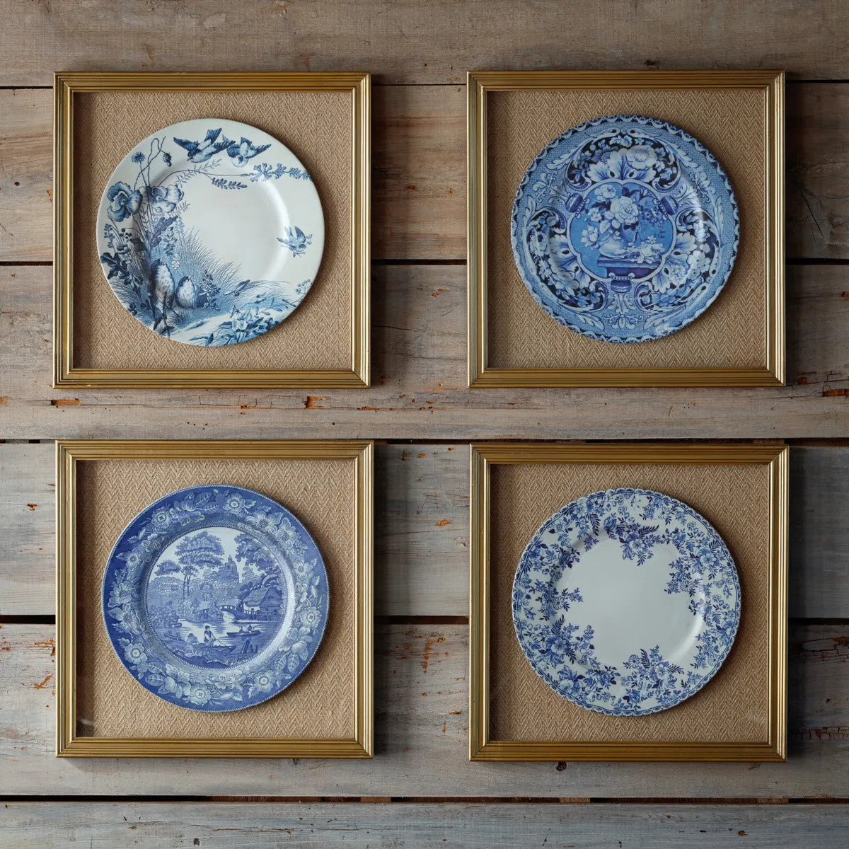 Framed print featuring a blue and white plate with classic rim detailing.