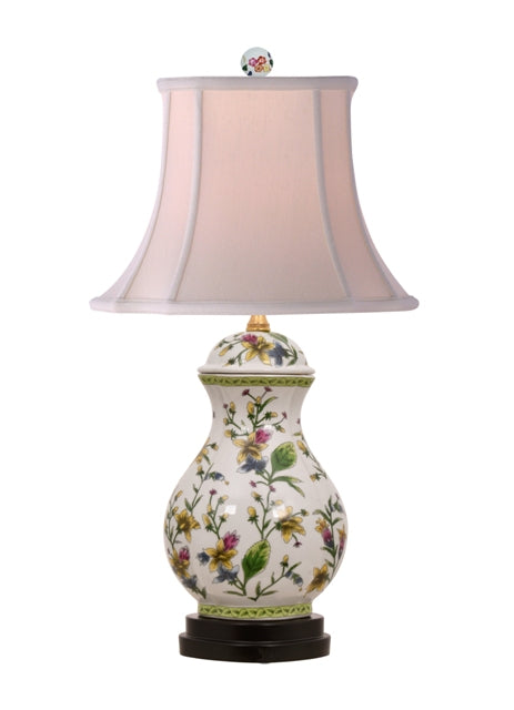White porcelain jar lamp with tulip floral scallop patterns on a rounded silhouette.