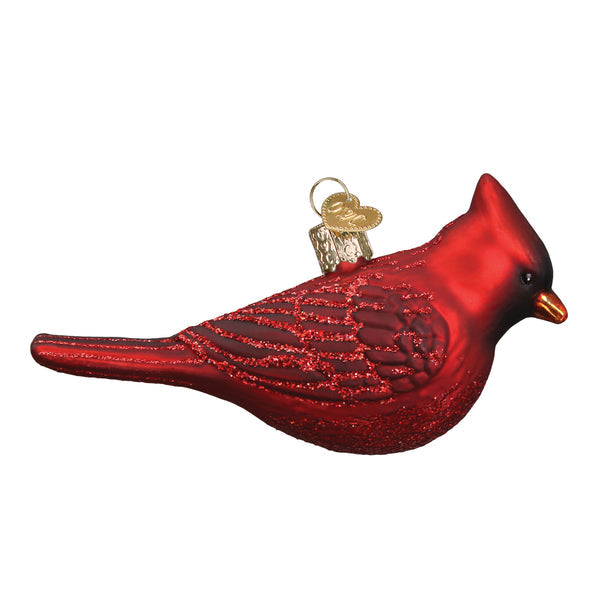 Glass Northern Cardinal ornament with red body, black mask, orange beak, and white wing accents.