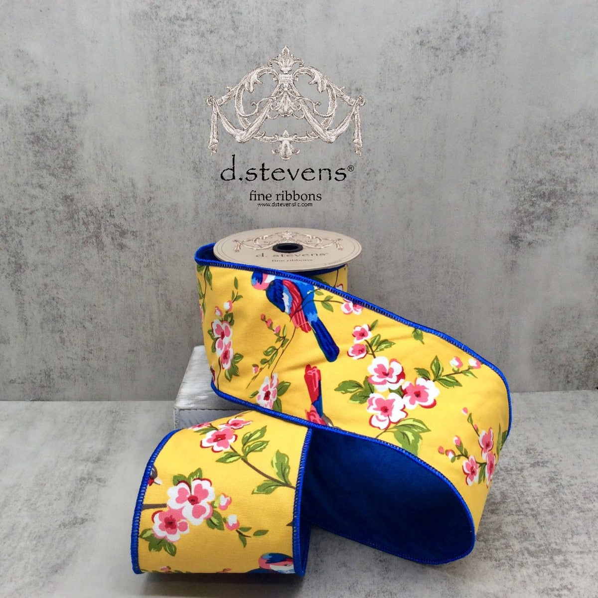 Ten yards of blue canvas ribbon featuring a cherry blossom bird print with golden yellow pink and blue accents.