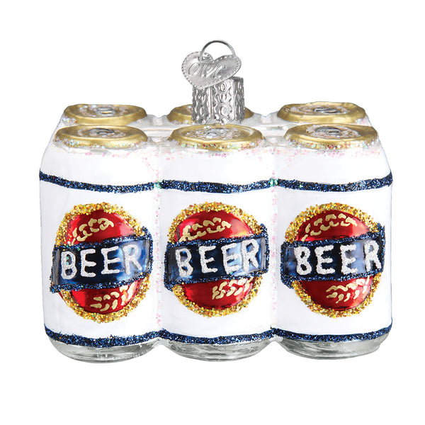 Glass Christmas ornament shaped like a six-pack of white beer cans with glittery red and blue labels.
