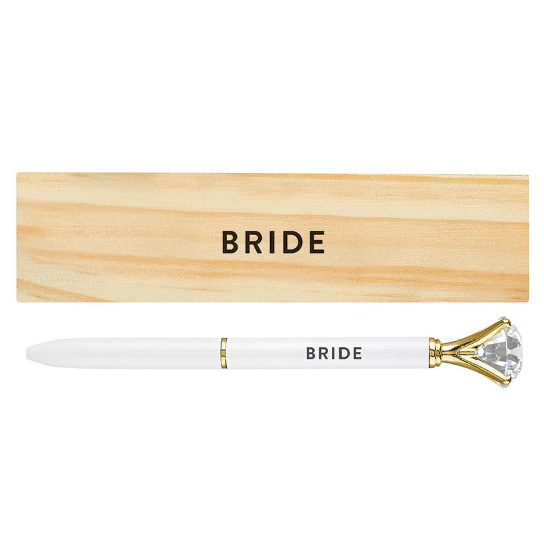 White gem-topped pen and matching pinewood box, both featuring the word BRIDE in black text.