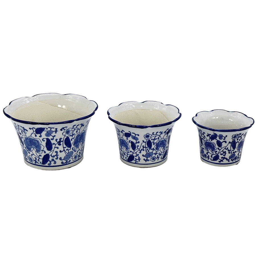 Blue and white floral ceramic pot with ruffled lip style