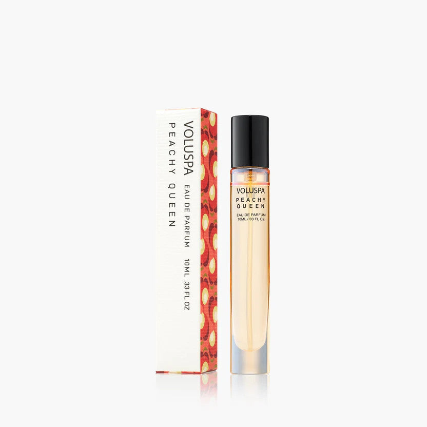 Voluspa Peachy Queen 10ml Eau De Parfum travel spray bottle next to its decorative floral box.