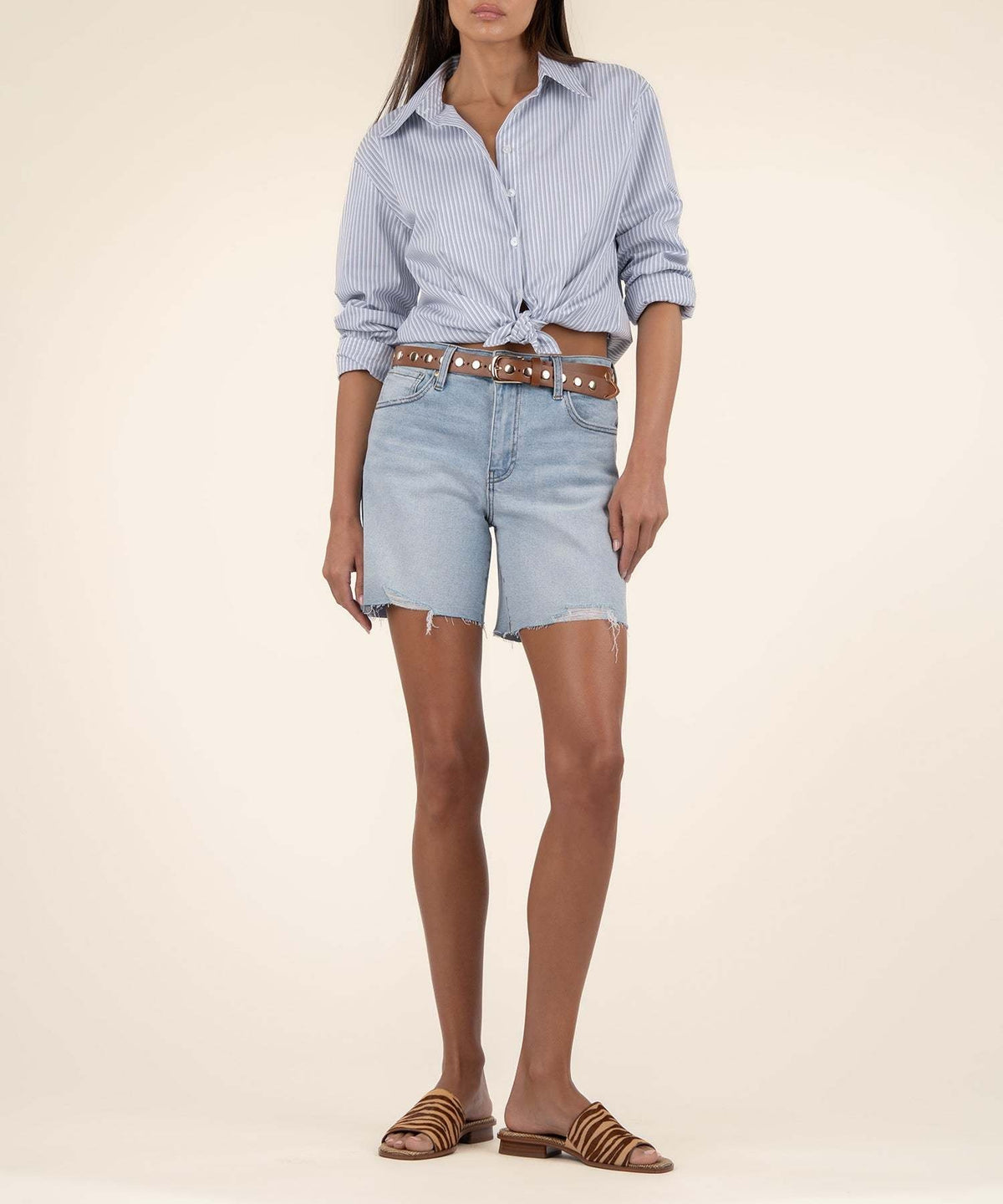 Front view of Hailey high-rise denim shorts in light wash with raw hem