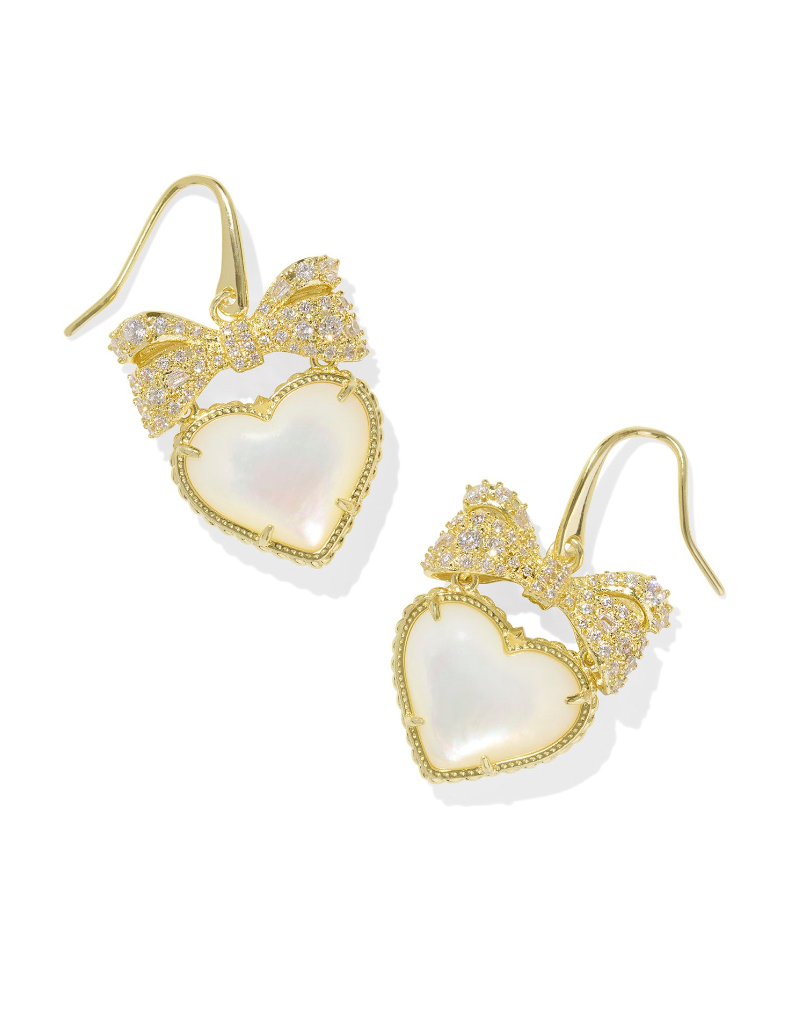 Gold drop earrings featuring a heart-shaped pendant with an ivory mother-of-pearl bow on top.