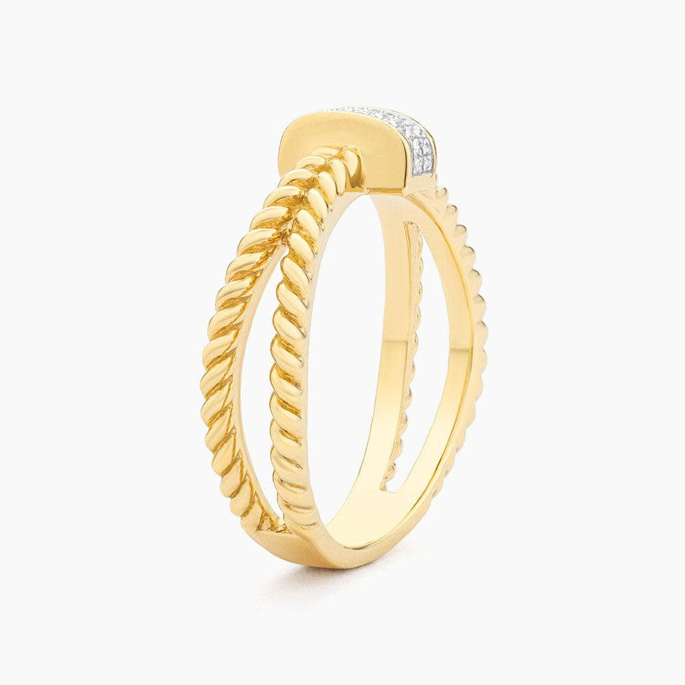Side view of a silver statement ring with an oval diamond-studded band.