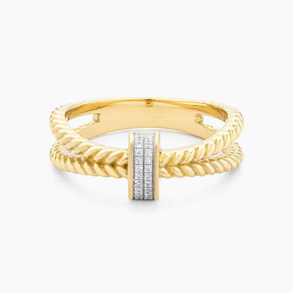 Silver statement ring with a wide band featuring a central diamond-studded geometric cluster.
