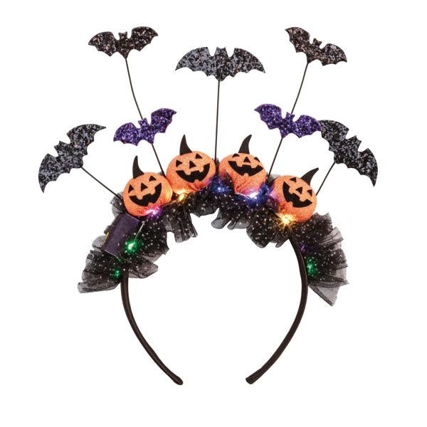 Halloween headband with LED lights, glitter felt, tulle trim, and pumpkin silhouette.
