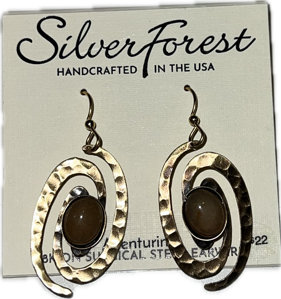 Handcrafted surgical steel earrings featuring hammered coil wire with an oval natural stone cabochon.