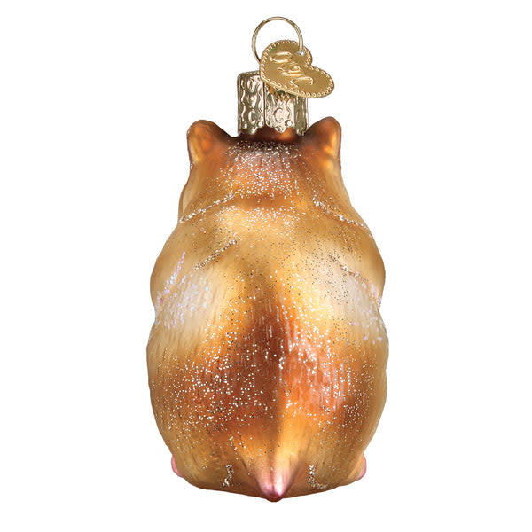 Hamster ornament figurine in brown fur with black eyes on a white base.