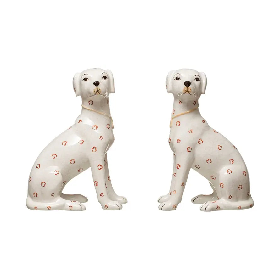 Hand-painted ceramic dog figurine with antique crackle finish in cream color featuring rust-colored spots.