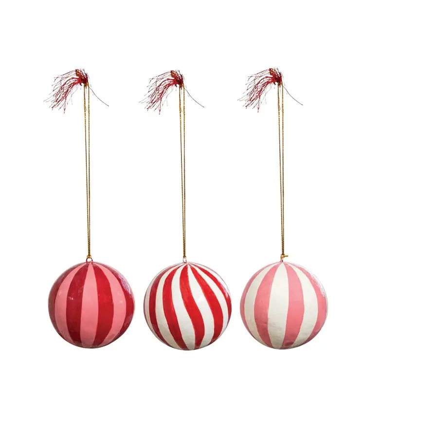 Hand-painted paper mache ball ornament with intricate festive patterns