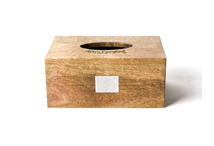 Mini rectangle tissue box cover made from natural mango wood with a carved Happy Everything logo on top.